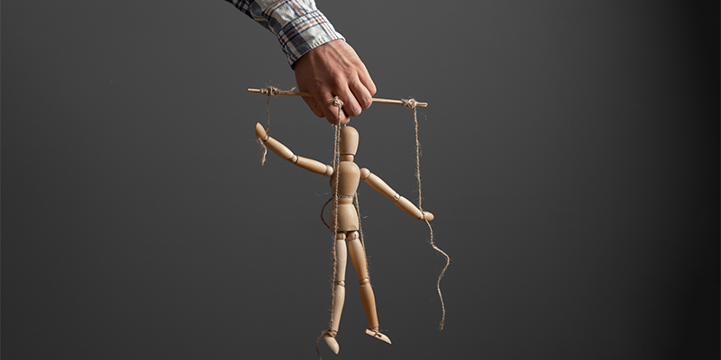 man-holding-puppet-represent-right-to-manage-control